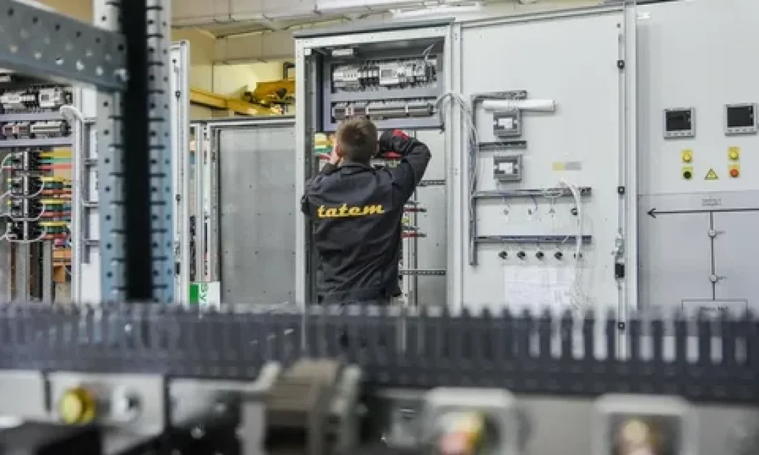 Specialists working with panel equipment