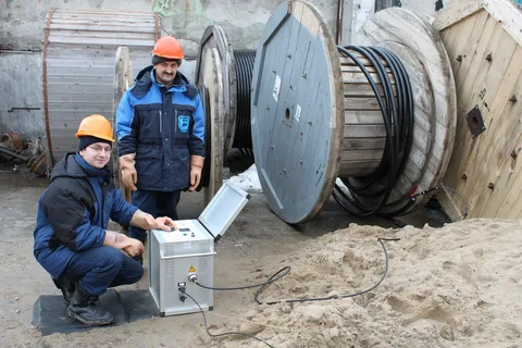 Specialists working with a cable line and equipment